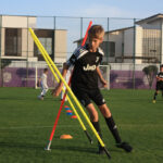 Boys and girls training football in Abu Dhabi